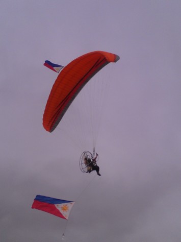 Paraglider carrying the Philippine Flag during the flag ceremony